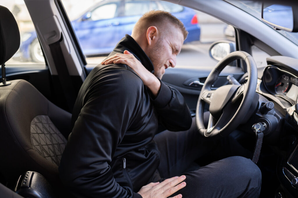 Car Driver Back Pain Injury. Bad Posture, neck, back, shoulder injuries